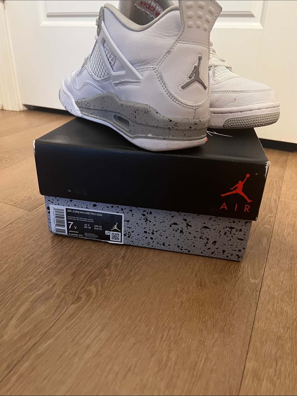 Jordan Retro 4 Sneakers in White and Gray